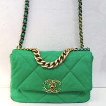 Load image into Gallery viewer, This Chanel Vintage 19 Green Lambskin bag has gold hardware including the double C logo which also has green woven between the double Cs. The gold shoulder chain has a thin green strip of leather woven between the chain links. It has a back outside pocket and the interior is green.