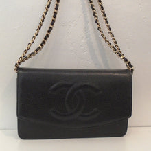 Load image into Gallery viewer, This Chanel Caviar Leather Half Moon WOC has a front half flap in a curved half moon design. The Chanel Logo is in raised three dimensional form. It has a double shoulder chain with a strip of leather woven between the links. The interior of this bag is black and has a zippered pouch.