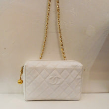 Load image into Gallery viewer, This Chanel Vintage Pure White Caviar Shoulder Bag has a zippered opening and gold hardware. The zipper has a gold ball attached to it. This bag has a gold shoulder chain, the diamond stitched pattern and the CC logo stitched in the center of a stitched diamond on the front of the bag. The interior is the same white shade as the outside of the bag.