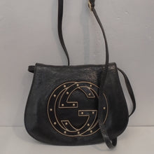 Load image into Gallery viewer, This Gucci Vintage Blondie Leather Bag is black with a large Gucci logo with inlaid leather edged in gold hardware. It has a detachable shoulder strap and the interior is black with a zippered section.