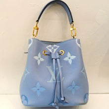 Load image into Gallery viewer, This Louis Vuitton Vintage Empreinte Leather BB Neonoe PM is a baby blue shade with two long leather strips, knotted at the ends coming from the top center of the bag. These strips are a drawstring for the bag. There are two straps included: a carring handle and a shoulder strap. Both of these straps are detachable. It has a large monogram pattern in shades of blue and white on the body of the bag. The interior of the bag is a soft baby blue.