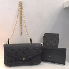 Load image into Gallery viewer, This Louis Vuitton Vintage Black Felicie Pochette is in monogram embossed empreinte leather. It has gold hardware, snaps closed in the front and includes a card holder and pouch to match. The interior is also black.