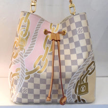 Load image into Gallery viewer, This Louis Vuitton Vintage Damier Azur Nautical Neo Noe is gray and white damier azur with nautical rope, chains and lock printed on the bag. It has a camel leather drawstring, gold hardware and a leather shoulder strap. The interior of the bag is a cream color with monogram design in gray and has a damier azr zippered pouch.