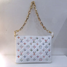 Load image into Gallery viewer, This Louis Vuitton Vintage Monogram Coussin Garden Collection has a white background with Spring colored monogram. It has a heavy detachable gold shoulder chain and guitar strap. This bag has a top zipper and lavender interior.