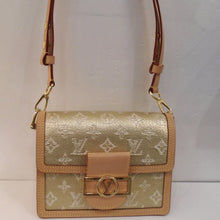 Load image into Gallery viewer, This Louis Vuitton Vintage Monogram Jacquard Mini Dauphine is gold with cream monogram. It has light camel trim and gold hardware. The clasp is a gold rectangle with a circle in its middle and Louis Vuitton Logo in the center. The interior is camel.