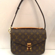 Load image into Gallery viewer, This Louis Vuitton Monogram Metis Pochette is in the traditional monogram style with a sturdy adjustable and removable strap. It has an interlocking snap front latch and a dark brown soft interior.