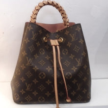 Load image into Gallery viewer, This Louis Vuitton Monogram Neo Noe is in the original Louis Vuitton Pattern with a camel drawstring and camel braided handle. It also comes with a pink and cream non adjustable shoulder strap. The interior of this bag is pink and has an inside zippered pouch divider in monogram.