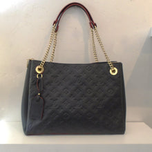 Load image into Gallery viewer, This Louis Vuitton vintage Navy Empreinte Leather Surene MM Tote has the Louis Vuitton monogram pressed into the leather. It has gold hardware, double shoulder chains with leather shoulder guards. The interior of this bag is also navy.