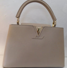 Load image into Gallery viewer, This Louis Vuitton Vintage Parnassea Capucines MM has gold hardware and is a turtle dove color. It has a thick carrying handle with a detachable crossbody and shoulder strap included. The interior is a chocolate color.