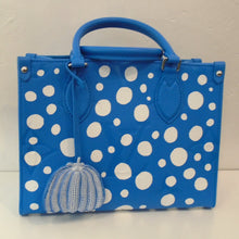Load image into Gallery viewer, This Louis Vuitton Vintage x Yayoi Kusama Blue Empreinte Leather On The Go PM is from the 2023 Collection. It has a sky blue background with white bubbles. This bag has double carrying handles and a key holder. It has silver hardware and is the same color blue inside.
