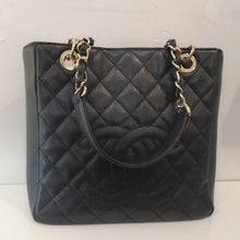 Load image into Gallery viewer, This Chanel Vintage Caviar Leather PST Series 15 is black in the diamond pattern. It has a chain shoulder strap with a black leather strip woven between the links and a black leather shoulder guard. It has the double C Chanel Logo in large raised letters on the front of the bag. The interior of this bag is black.
