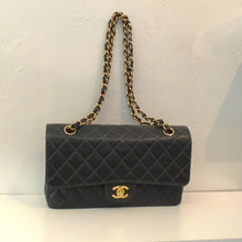 Load image into Gallery viewer, This Chanel Vintage Double Flap 2.55 Caviar Leather bag has the Chanel logo  in gold on the lip of the front flap. It has the quilted diamond stitched pattern and double shoulder chain. The interior of this bag is Black.
