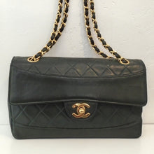Load image into Gallery viewer, This Chanel Vintage Lambskin Single Flap 25 is in olive green with 24 Karat gold plated hardware. It has the original diamond stitched pattern with a smooth section on the front flap and bottom of the bag. It has a shoulder chain with a leather strip woven between the chain links.
