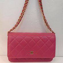 Load image into Gallery viewer, This Chanel Vintage Pink Matte Lambskin WOC has the diamond stitch pattern through out the bag. It has gold hardware which includes the Chanel logo on the front flap of the bag. It has a double chain shoulder strap with a strip of pink leather woven between the chain links. This bag has an outside back pocket. The interior of this bag is also pink.
