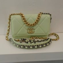 Load image into Gallery viewer, This Chanel Sherbet Green 19 WOC has diamond stitching, a front flap with the logo in gold with sherbet green beads. The WOC shoulder chain is made of mixed metal hardware with a shoulder guard in the same sherbet green color. The interior of this bag is also Sherbet Green.
