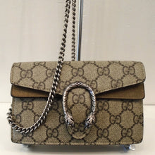 Load image into Gallery viewer, This Gucci Vintage Mini Dionysus Supreme GG has the original Gucci Pattern with silver hardware. The front clasp is in the form of a two headed snake in the shape of a horseshoe. The bag has a long crossbody length shoulder chain and the interior is a soft beige.
