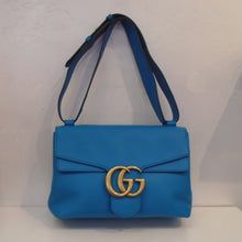Load image into Gallery viewer, This Gucci Vintage Marmont Shoulder Bag is sky blue with gold hardware which includes the Gucci logo on the front latch of the bag. The interior of this bag is a soft sand color.
