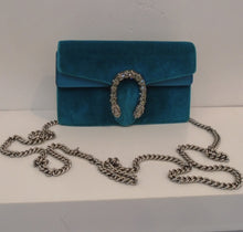 Load image into Gallery viewer, This Gucci Vintage Teal Velvet Mini Dionysus has silver hardware which includes the horse shoe shaped double headed dragon front latch and shoulder chain. The interior of this bag is tan.
