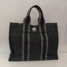 Load image into Gallery viewer, This Hermes Black/Gray Canvas Fourre' Toute PM is simply a canvas tote bag. The interior of this bag is black. The name is French.

