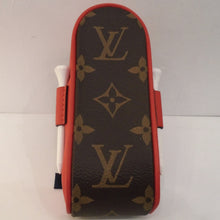 Load image into Gallery viewer, This Louis Vuitton Vintage Andrews Red Golf Ball Case has four gold tees and three golf balls included with the case. The golf balls have the Louis Vuitton Logo on them and the golf tees are white. The case is in the original Louis Vuitton Monogram pattern with red trim.

