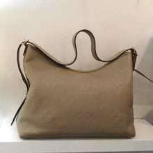 Load image into Gallery viewer, Louis Vuitton Vintage Beige Empreinte Leather Carryall With Pochette
