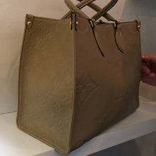 Load image into Gallery viewer, Louis Vuitton Vintage Beige Empreinte Leather On The Go MM
