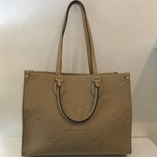Load image into Gallery viewer, Louis Vuitton Vintage Beige Empreinte Leather On The Go MM
