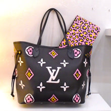 Load image into Gallery viewer, This Louis Vuitton Vintage Black Wild At Heart Neverfull MM With Pochette has large monogram in white, pink and yellow. The inside of the bag is gray with black leopard spots. This bag comes with a  Pochette that is pink with yellow cheetah spots.
