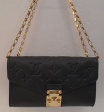 Load image into Gallery viewer, This Louis Vuitton Vintage Black Monogram Saint Germain Mini is embossed on empreinte leather. This bag has gold hardware, and a double shoulder chain. The interior is black, has a zippered pocket and holder for cards.
