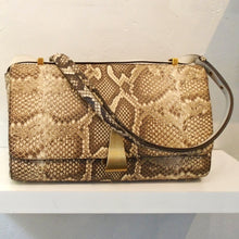Load image into Gallery viewer, This Bottega Veneta Original Python Shoulder Bag has gold hardware which includes the front clasp, back and inside zippers. The interior color of this bag is cream.
