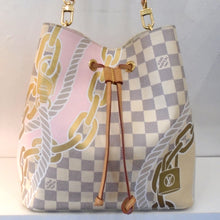 Load image into Gallery viewer, This Louis Vuitton Vintage Damier Azur Nautical Neo Noe is gray and white damier azur with nautical rope, chains and lock printed on the bag. It has a camel leather drawstring, gold hardware and a leather shoulder strap. The interior of the bag is a cream color with monogram design in gray and has a damier azr zippered pouch.
