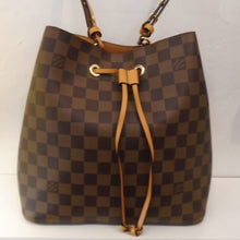 Load image into Gallery viewer, This Louis Vuitton Vintage Damier Ebene N`eo No`e has camel trim which includes the leather drawstring and shoulder strap. The interior of this bag is also camel.
