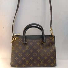 Load image into Gallery viewer, This Louis Vuitton Vintage Monogram/Black Pallas BB is a black leather bag with original monogram on both sides of the bag leaving the sides showing the black bag. It has two carrying handles and a long detachable shoulder strap included. The bag has gold hardware and a black interior.
