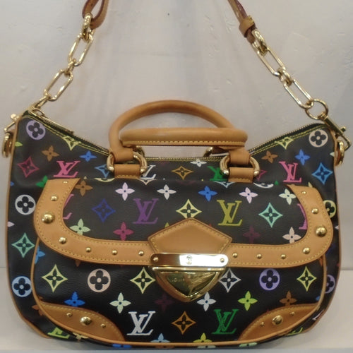 This Louis Vuitton Vintage Monogram Black Multicolor Rita has  a vibrant multicolored  monogram pattern with camel trim and gold hardware. The shoulder strap has a camel leather shoulder guard with a heavy gold chain at either end which is removable. The interior of the bag is taupe.