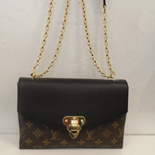 Load image into Gallery viewer, This Louis Vuitton Vintage Monogram/Black Saint Placide has a monogram body with a black flap and gold hardware. It has a double gold shoulder chain attached to a black leather shoulder guard. The interior is a soft black.
