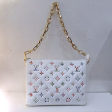 Load image into Gallery viewer, This Louis Vuitton Vintage Monogram Coussin Garden Collection has a white background with Spring colored monogram. It has a heavy detachable gold shoulder chain and guitar strap. This bag has a top zipper and lavender interior.
