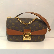 Load image into Gallery viewer, This Louis Vuitton Vintage Monogram Caramel Leather Marceau is in the original Louis Vuitton Monogram with a caramel strip across the bottom of the front flap. The shoulder guard is also caramel along with the back pocket. The interior of the bag is also caramel.
