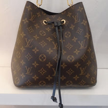 Load image into Gallery viewer, This Louis Vuitton Vintage Monogram/Black NeoNoe is in the original monogram colors and has black trim and gold hardware. The interior of the bag is black with a monogram zippered change purse in its center.
