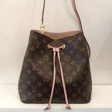 Load image into Gallery viewer, This Louis Vuitton Vintage Monogram NeoNoe has the traditional brown monogram pattern on the outside of the bag. It has a pink leather strip for the drawstring which dangles down the front of the bag knotted at the ends.  This bag has a detachable pink shoulder strap and the interior is a pink mauve shade.
