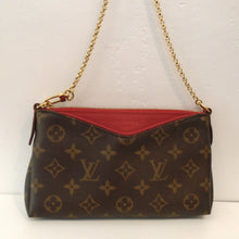 Load image into Gallery viewer, This Louis Vuitton Vintage Monogram/Leather Pallas Clutch is in the original Louis Vuitton Monogram with a V lip which shows the red zippered center pouch. It has both a detachable shoulder strap and chain strap. The interior of this bag is red. With both straps detached it can be used as a clutch.
