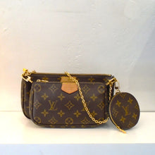 Load image into Gallery viewer, This Louis Vuitton Vintage Multi Pochette Accessoires Monogram comes with a detachable shoulder chain and a forest green Louis Vuitton Guitar Strap. This bag has camel trim and has two sections both with top zippers. It has a round zippered pochette attached to the side of the bag. The interior is a soft brown.
