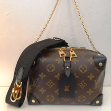 Load image into Gallery viewer, This Louis Vuitton Vintage Monogram Macassar Petite Malle Souple is in the original monogram pattern with corner protectors in black. It has a double headed zipper for the top opening. This bag has a  sturdy black carrying handle, a detachable gold shoulder chain and detachable guitar strap included. It has black trim and  a black interior.
