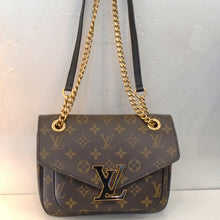 Load image into Gallery viewer, This Louis Vuitton Vintage Monogram Passy has the original monogram pattern with a black Louis Vuitton Logo Lined in gold on the front flap of the bag. It has gold hardware, a gold carrying chain and black shoulder strap. The interior of this bag is burgandy.
