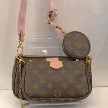 Load image into Gallery viewer, This Louis Vuitton Vintage Monogram Pochette-Accessoires is a shoulder bag made of three pochettes, a pink detachable Louis Vuitton guitar strap and a round zippered change purse. It also has a detachable shoulder chain. The interior of the bag is a soft brown.
