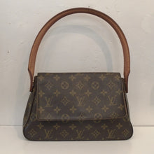 Load image into Gallery viewer, This Louis Vuitton Vintage Monogram Shoulder Loop is in the original monogram pattern. It has a loop carrying handle large enough to wear as a shoulder bag. It has a front flap that reaches three quarters from the bottom of the bag. The interior of this bag is camel.
