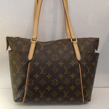 Load image into Gallery viewer, This Louis Vuitton Monogram Totally PM is in the original monogram pattern with camel trim. It has double shoulder straps with pockets on each side. The top zipper opens up to a dark camel interior.

