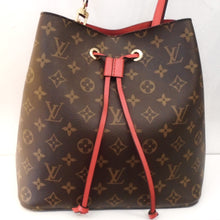 Load image into Gallery viewer, This Louis Vuitton Vintage Monogram Neo Noe has the original Louis Vuitton Monogram pattern with a red leather draw string and a red adjustable shoulder strap. The interior of the bag is red and it has a middle zippered pocket.
