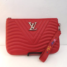 Load image into Gallery viewer, This New Wave Pochette bag is red in the chevron wave pattern and has the Louis Vuitton Logo in gold at the top center of the front of the bag. It has a top zipper opening. There is a red leather loop with the word Vuitton in assorted colors stitched on one side attached to the side of the bag for easy carrying. The interior of this bag is also red.
