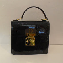 Load image into Gallery viewer, This Louis Vuitton Vintage Patent/Epi Leather Spring Street Bag is black with gold hardware which includes the front latch. It has a black carrying handle and comes with a shoulder strap. It has a luggage tag that matches the monogram shoulder strap. The interior color of this bag is black.
