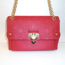 Load image into Gallery viewer, This Louis Vuitton Vintage Red Empreinte Leather Vavin PM has gold hardware which includes the double shoulder chain. The shoulder chain also has a red leather shoulder guard. While front flap is embossed with the monogram pattern, the rest of the bag is not. The interior of this bag is also red.

